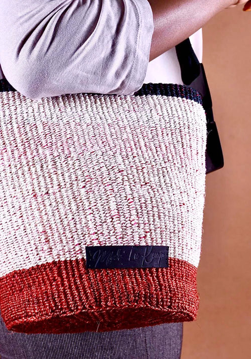 Textured bag with a visible brand label against a brown background