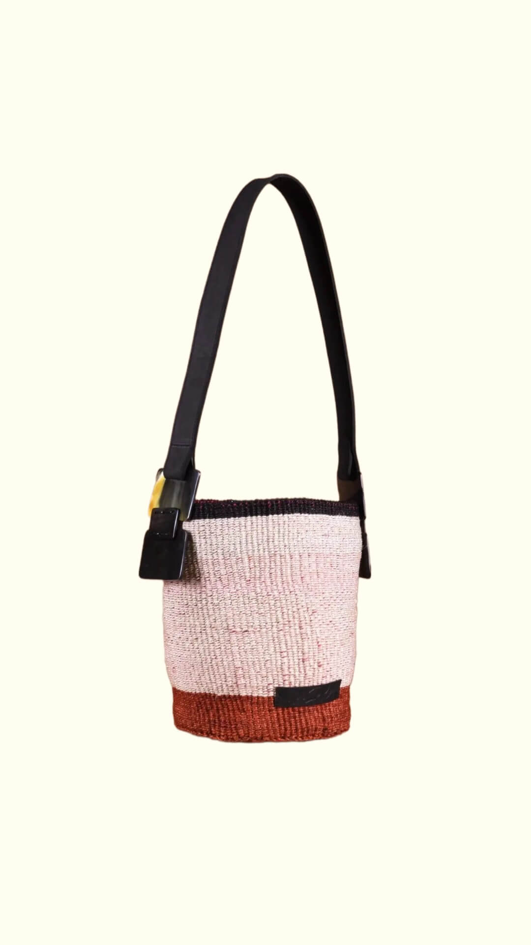 Multicolored bag with a strap on a white background