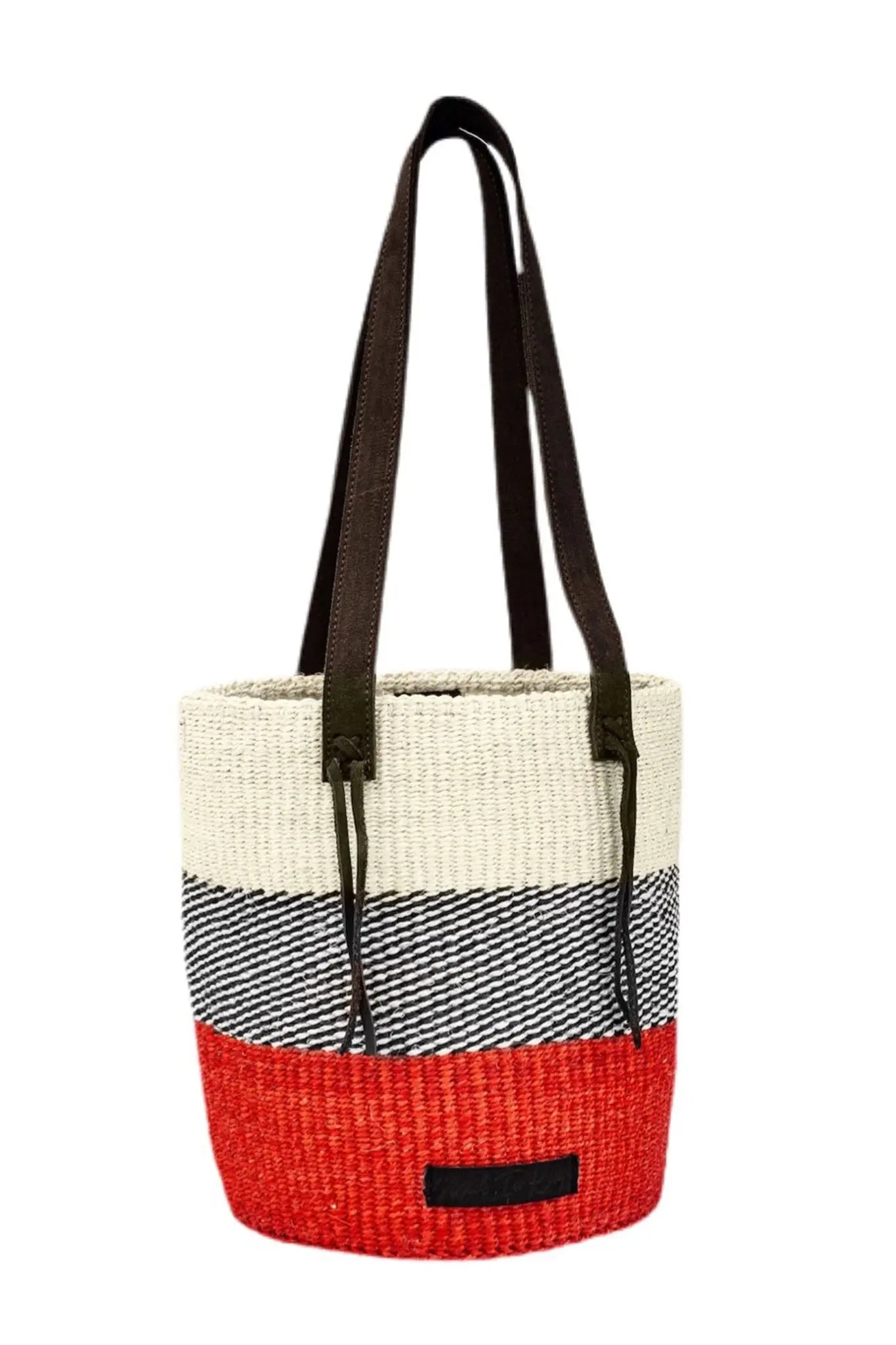Woven tote bag with a red bottom section, black handle, and white top section on a white background