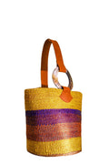 Woven basket with a colorful pattern on a white background. Artisans made the bag from Africa 
