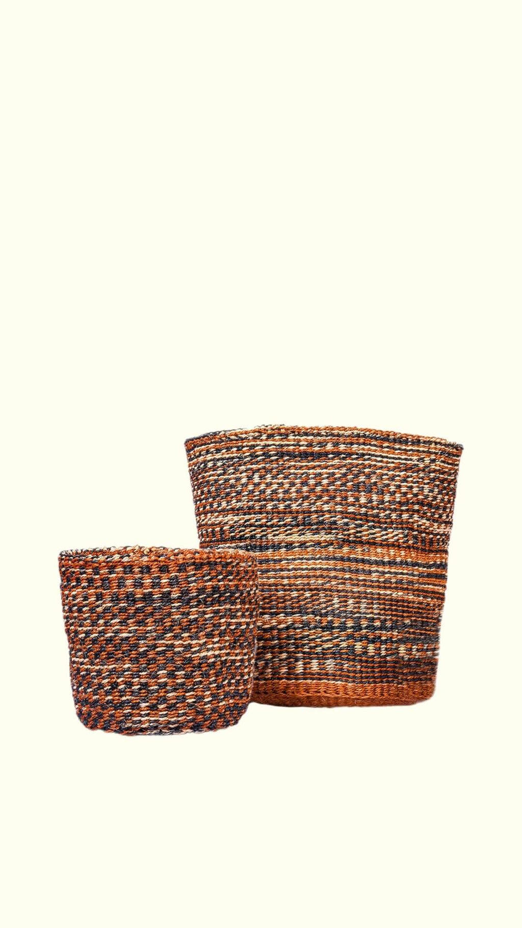 Two woven baskets with a striped pattern on a white background