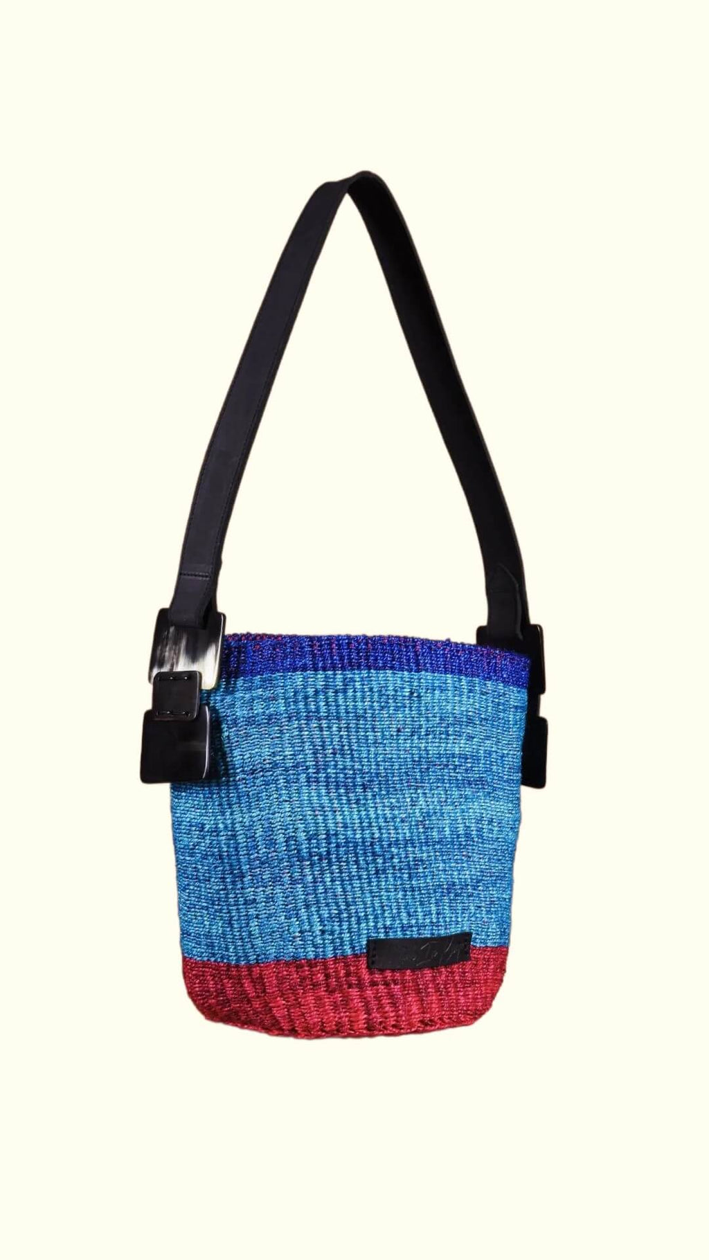 Multicolored bag with a strap on a white background